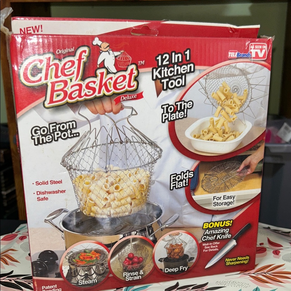 Deluxe 12-in-1 Kitchen Tool - Silver chef basket. Instructions are in the box